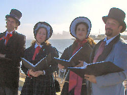 Carolers were serenading us with holiday selections. 